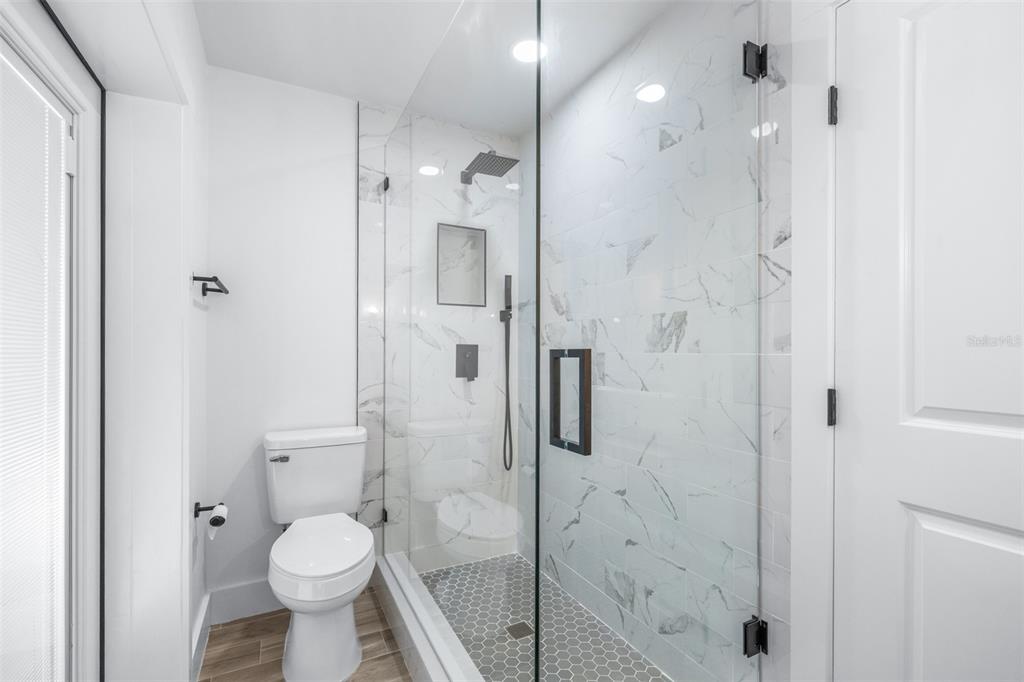 6312 Fairway Boulevard Apollo Beach, FL 33572 - Photo 27 of 58 a bathroom with a shower toilet and sink