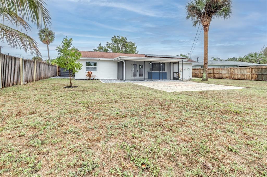 6312 Fairway Boulevard Apollo Beach, FL 33572 - Photo 43 of 58 a view of a house with backyard and a tree