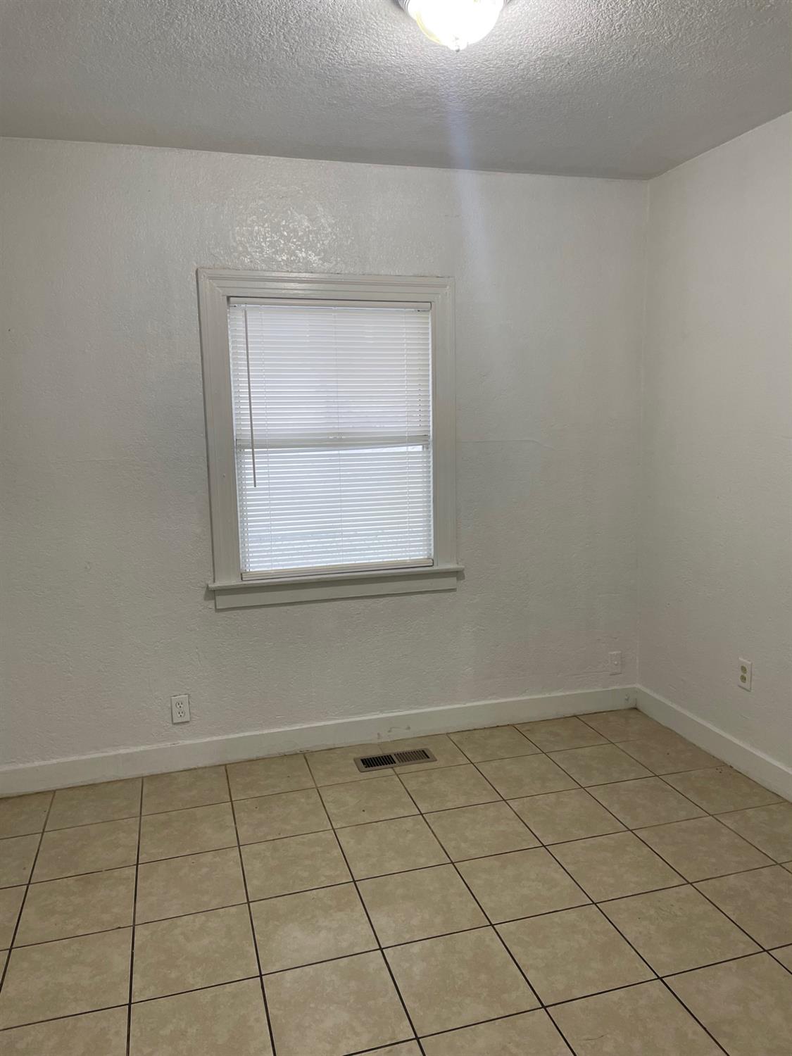 421 East Elm Street Lodi, CA 95240 - Photo 13 of 17 a view of a room that has a window in it