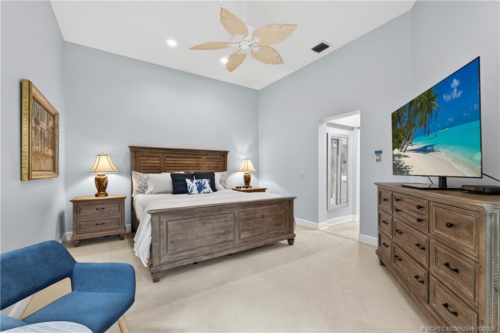 13009 Harbour Ridge Boulevard Palm City, FL 34990 - Photo 15 of 38 a living room with furniture and a flat screen tv