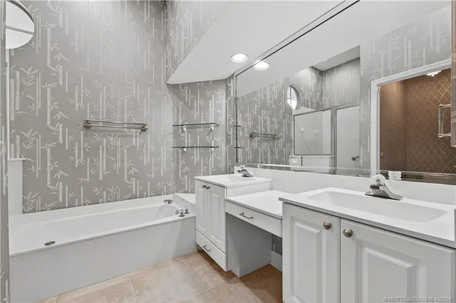 a bathroom with a bathtub and a shower