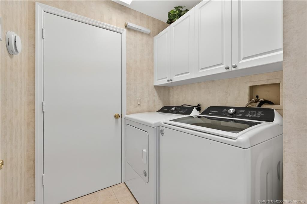 13009 Harbour Ridge Boulevard Palm City, FL 34990 - Photo 22 of 38 a view of utility room with washer and dryer