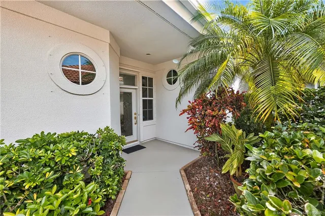 an aerial view of a house with yard swimming pool and outdoor seating