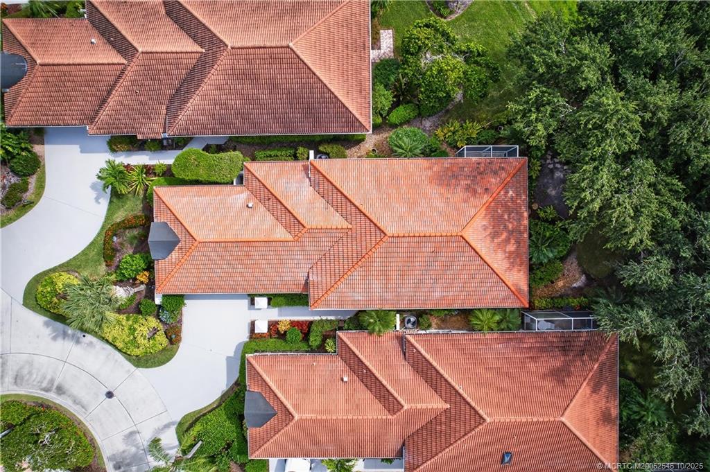13009 Harbour Ridge Boulevard Palm City, FL 34990 - Photo 30 of 38 an aerial view of a house with yard swimming pool and outdoor seating
