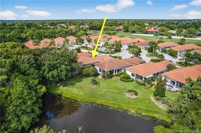 an aerial view of residential houses with outdoor space and street view