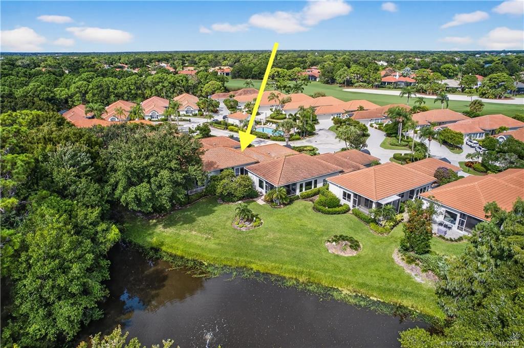 13009 Harbour Ridge Boulevard Palm City, FL 34990 - Photo 32 of 38 an aerial view of residential houses with outdoor space and street view