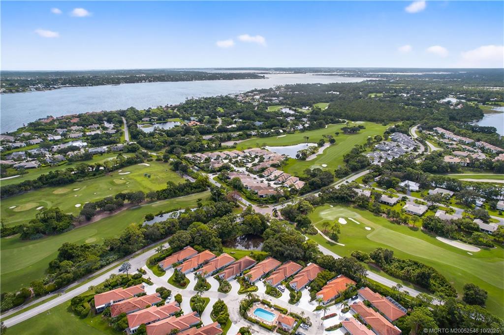 13009 Harbour Ridge Boulevard Palm City, FL 34990 - Photo 35 of 38 an aerial view of residential houses with outdoor space