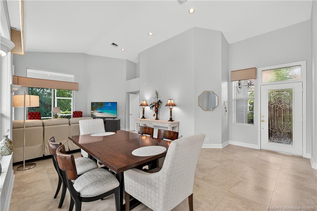 13009 Harbour Ridge Boulevard Palm City, FL 34990 - Photo 5 of 38 a dining room with furniture and window