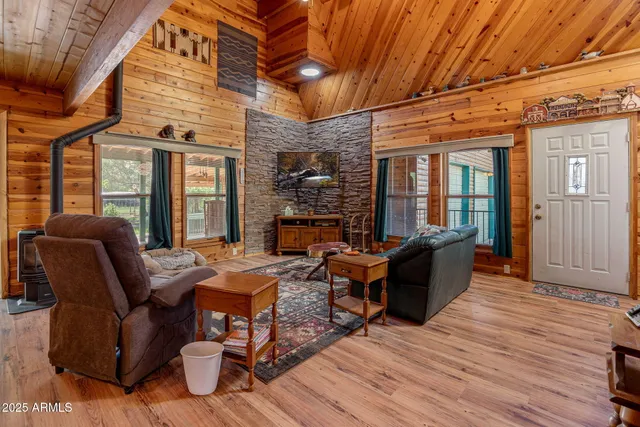 a outdoor living space with furniture and a fireplace