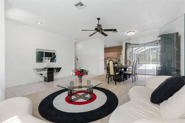 a dining room with furniture and window