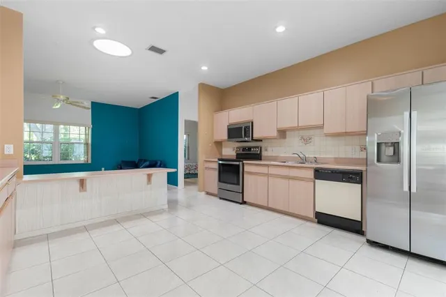a view of an empty room with a bathroom