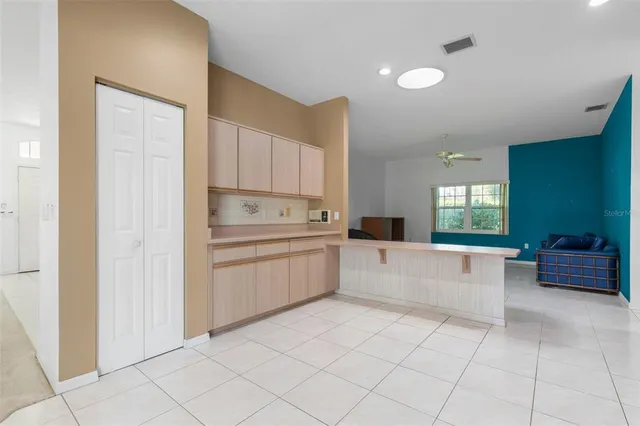 a bathroom with a granite countertop sink mirror and double