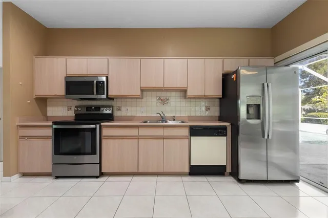 an empty room with furniture and a mirror