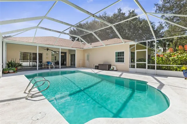 a front view of a house with a garden and plants