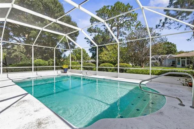 a view of a kitchen area kitchen island furniture and a chandelier