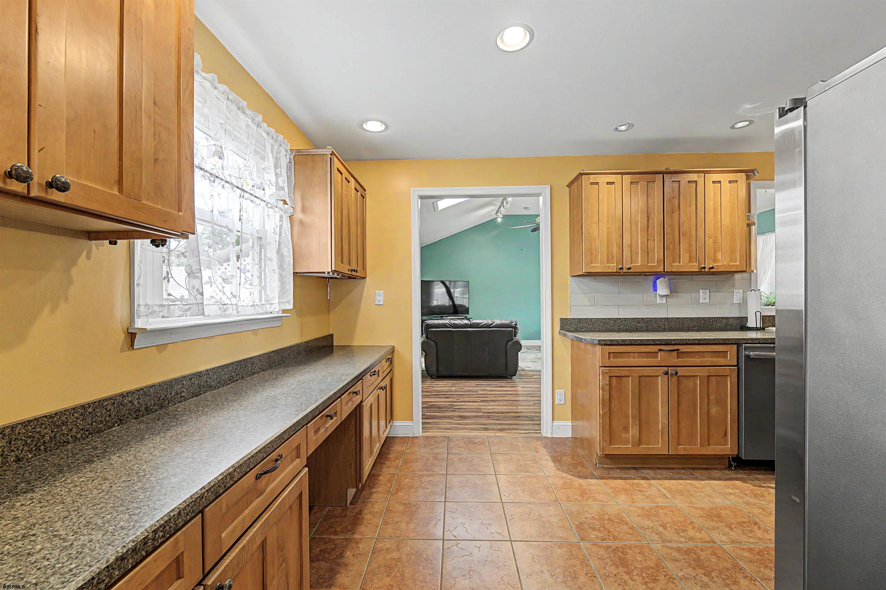 125 Exton Road Somers Point, NJ 08244 - Photo 10 of 35 a kitchen with stainless steel appliances a stove sink and cabinets