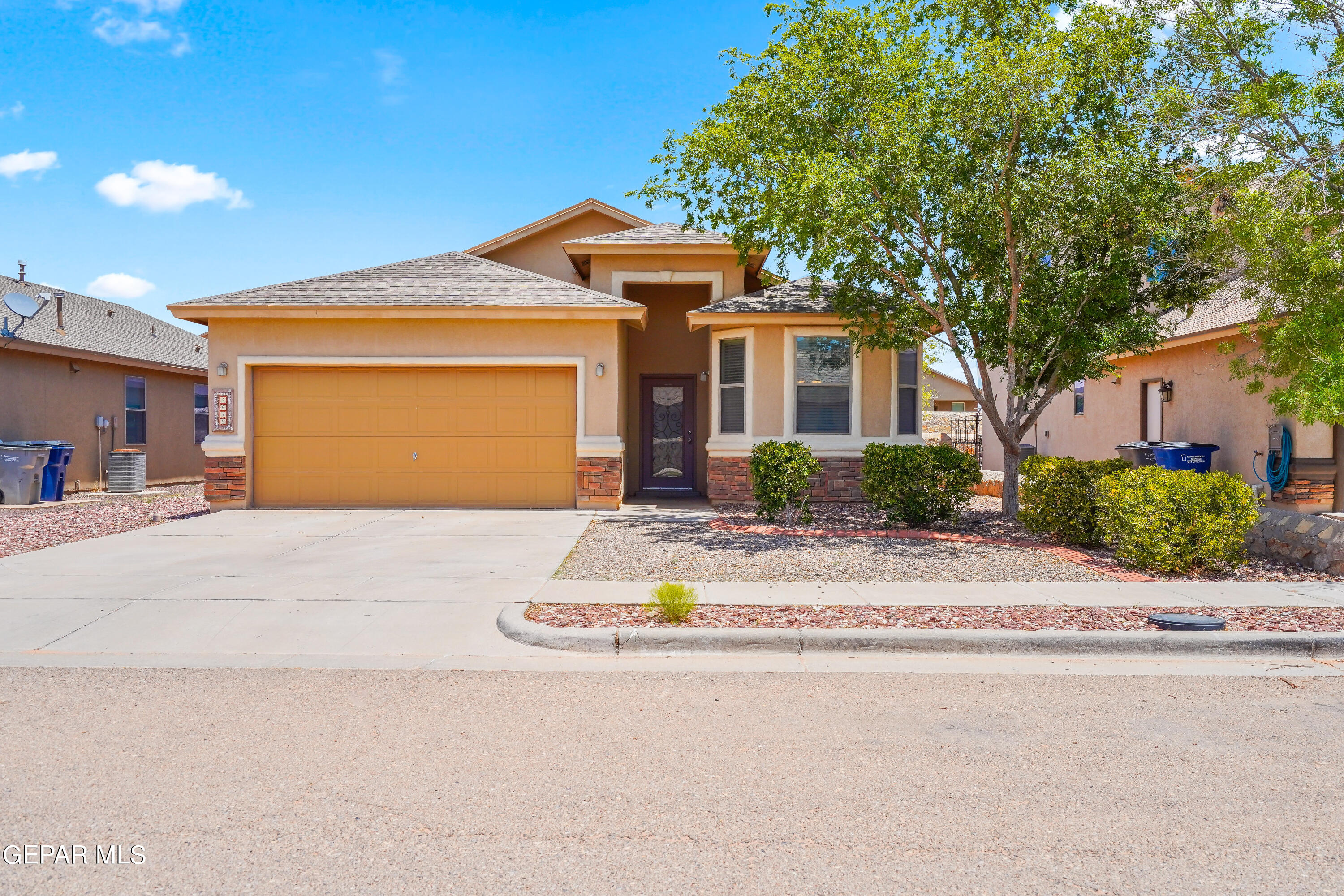 4616 Sean Sims Street El Paso, TX 79938 - Photo 1 of 1 a front view of house with yard and green space