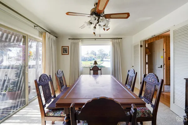 a view of a dining room with furniture window and outside view