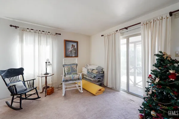 a room with furniture and a potted plant