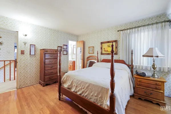 a bedroom with a bed and a closet