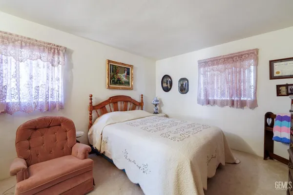a work room with furniture and wooden floor