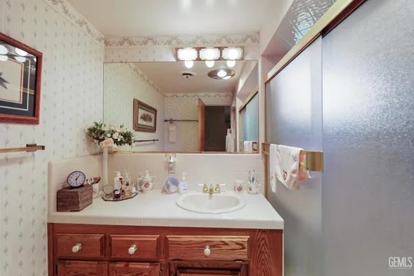 a bed room with a bed and a chair