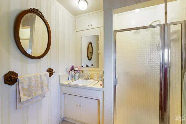 a view of staircase with wooden floor and chair