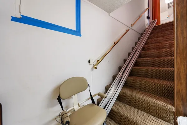 a view of empty room with cabinet
