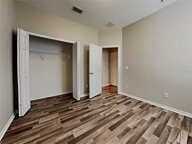 a view of a livingroom with wooden floor