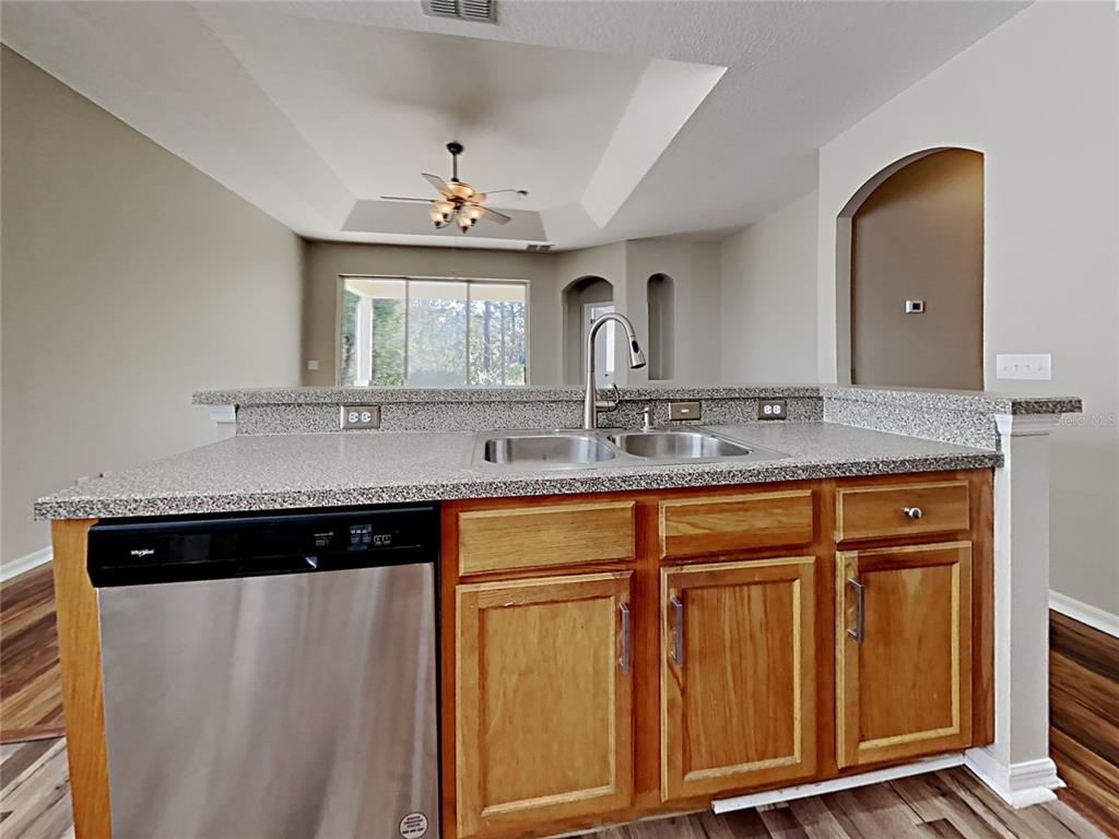 14136 Bradbury Road Orlando, FL 32828 - Photo 16 of 24 a view of a granite countertop sink