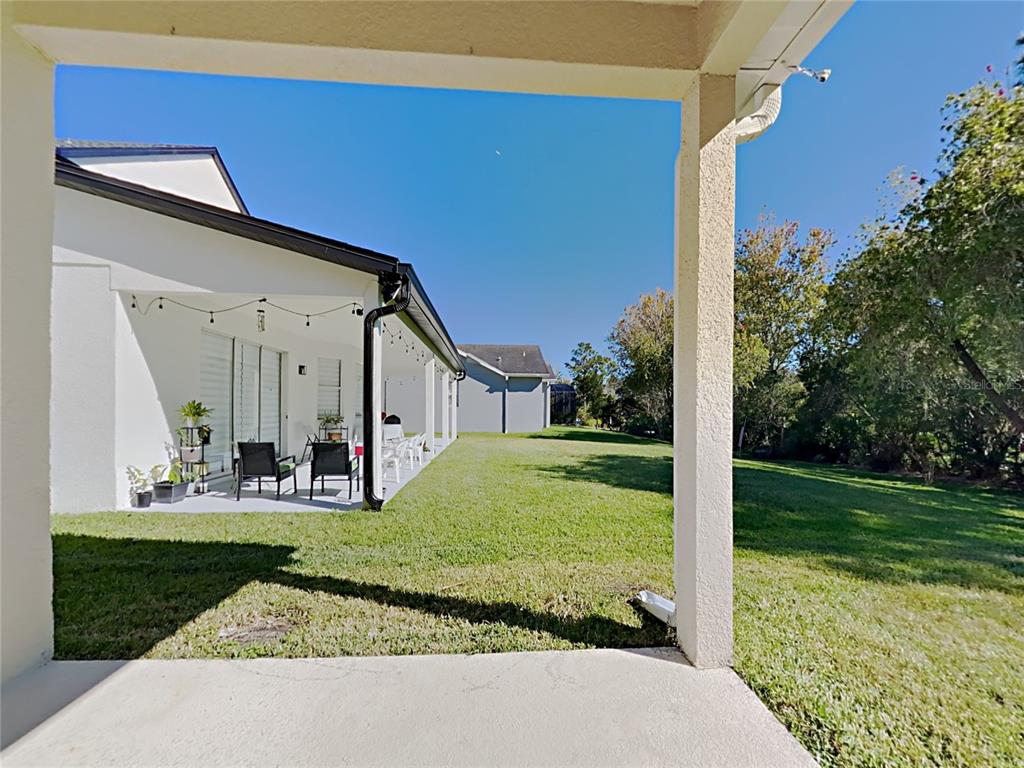 14136 Bradbury Road Orlando, FL 32828 - Photo 24 of 24 a front view of a house with garden