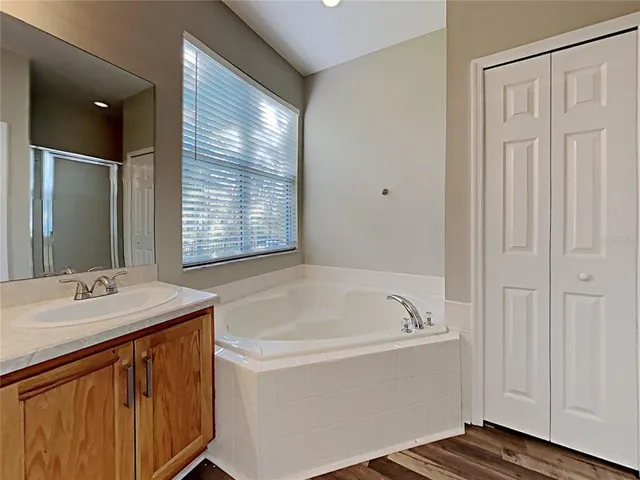 a bathroom with a bathtub and a sink