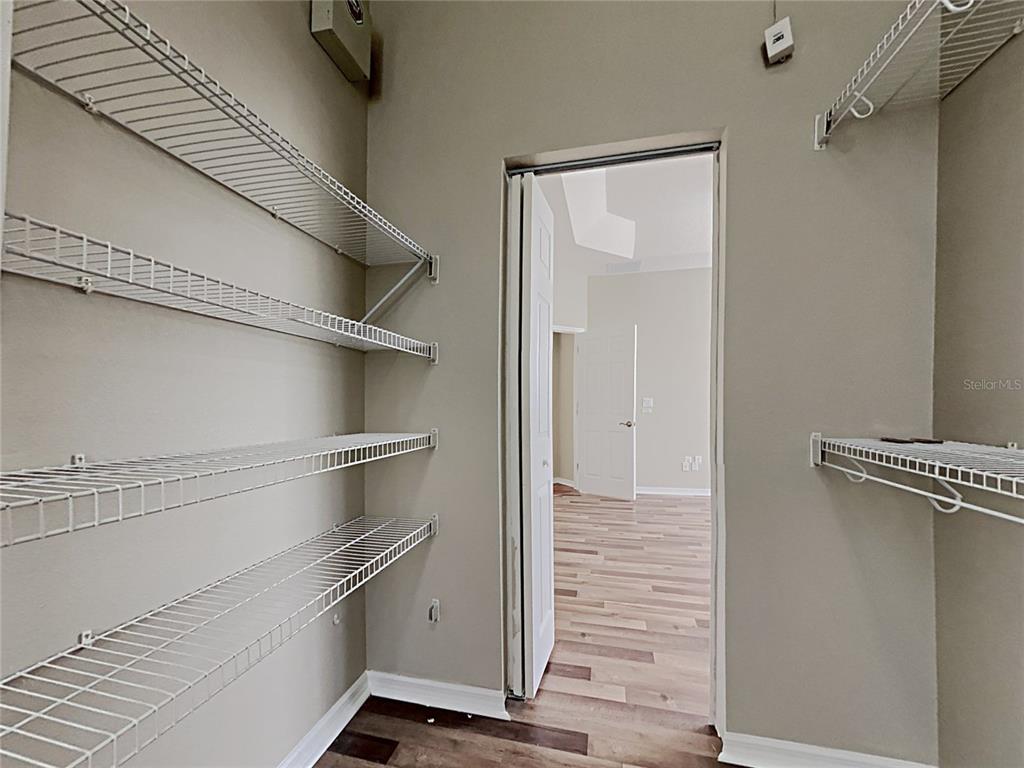 14136 Bradbury Road Orlando, FL 32828 - Photo 8 of 24 a view of walk in closet