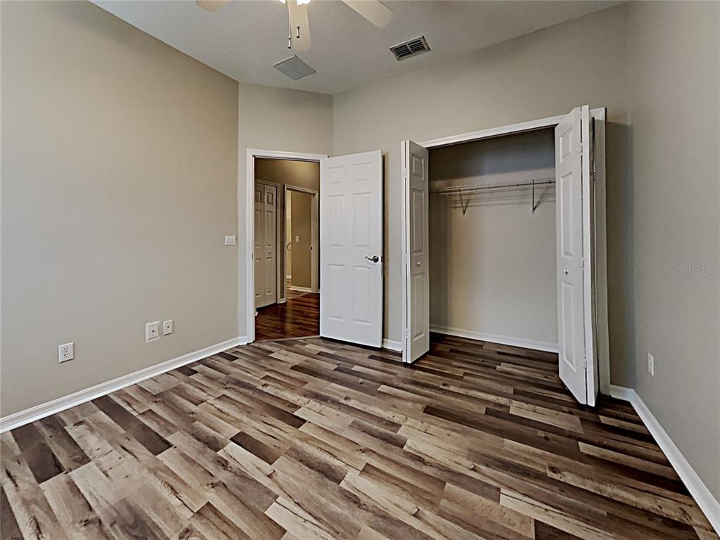 14136 Bradbury Road Orlando, FL 32828 - Photo 9 of 24 a view of an empty room and wooden floor