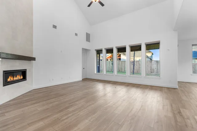 a spacious bathroom with a double vanity sink mirror and bathtub