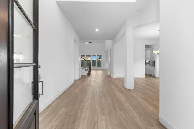 a large kitchen with stainless steel appliances lots of counter space and a sink