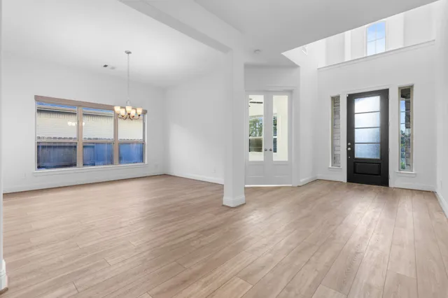 a kitchen with kitchen island granite countertop a sink stainless steel appliances and cabinets