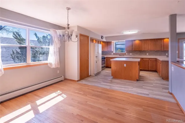 a view of a room with window and wooden floor