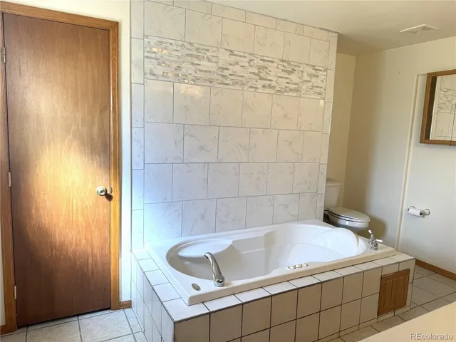 a bathroom with a sink a vanity and a mirror
