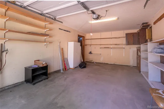 a view of a house with a yard and roof