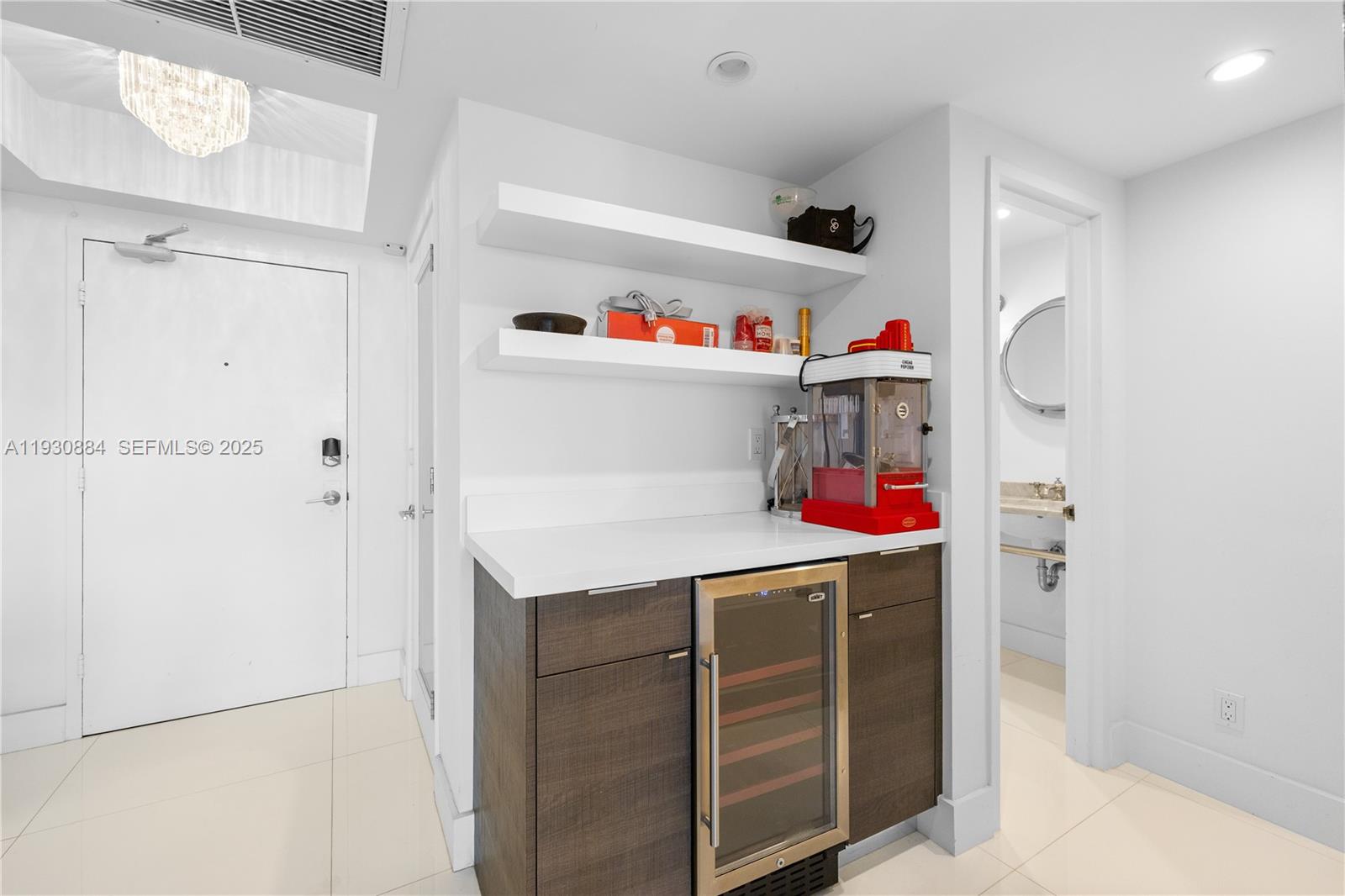 100 Lincoln Road, Unit 1523 Miami Beach, FL 33139 - Photo 6 of 24 a utility room with fridge and closet