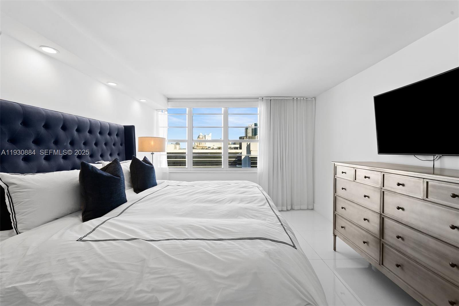 100 Lincoln Road, Unit 1523 Miami Beach, FL 33139 - Photo 8 of 24 a living room with furniture and a flat screen tv