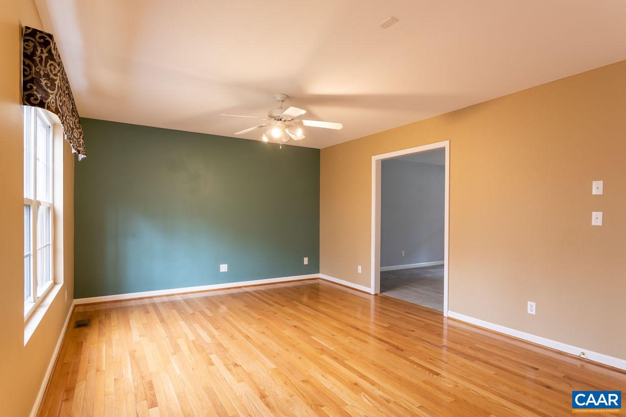 53 East Point Road Palmyra, VA 22963 - Photo 14 of 47 an empty room with wooden floor and windows