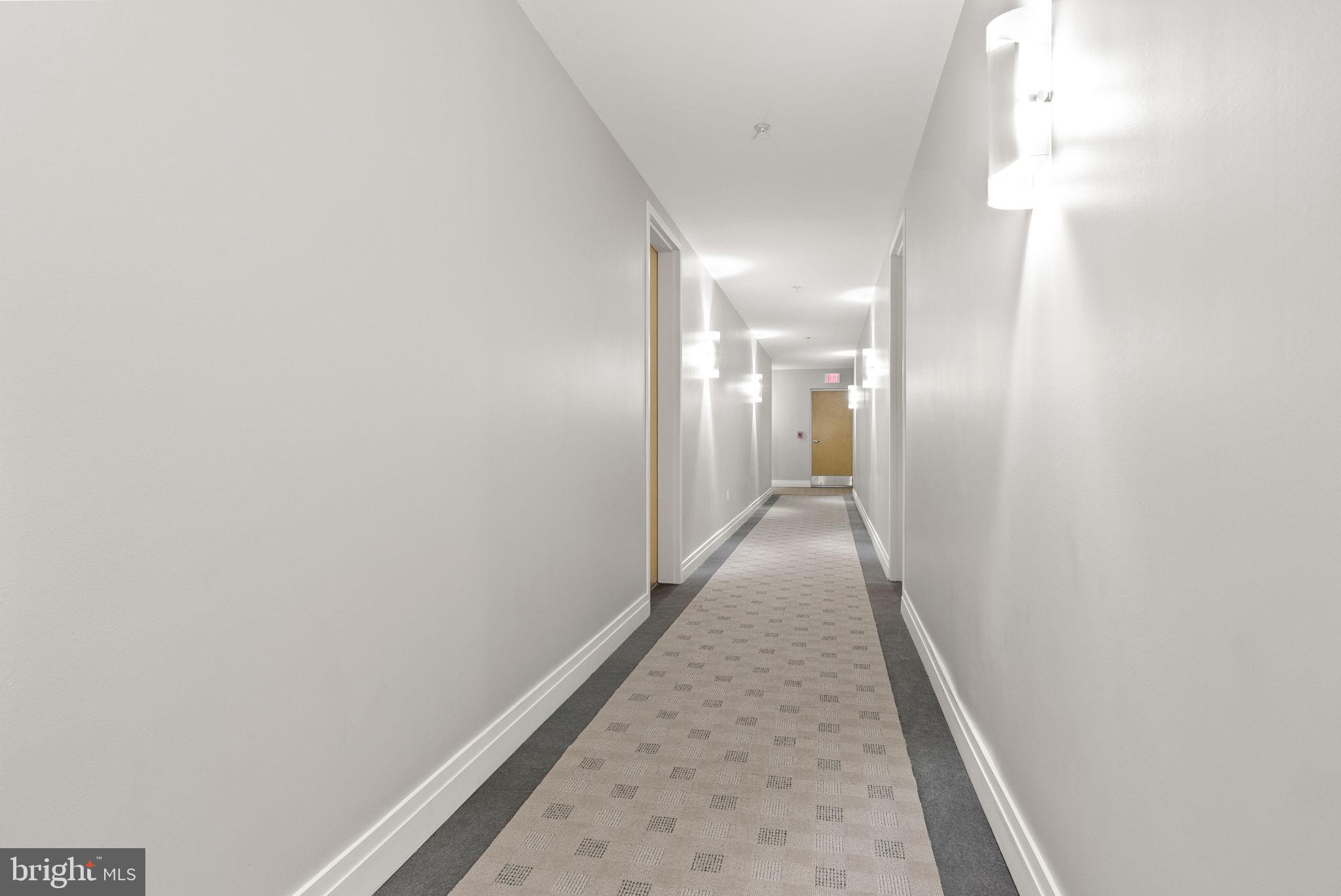 1300 13th Street Northwest, Unit 408 Washington, DC 20005 - Photo 11 of 47 a view of a hallway with wooden floor