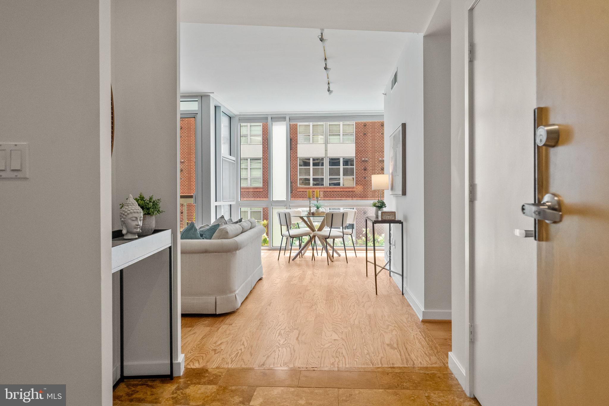 1300 13th Street Northwest, Unit 408 Washington, DC 20005 - Photo 15 of 47 a dining room with furniture and wooden floor
