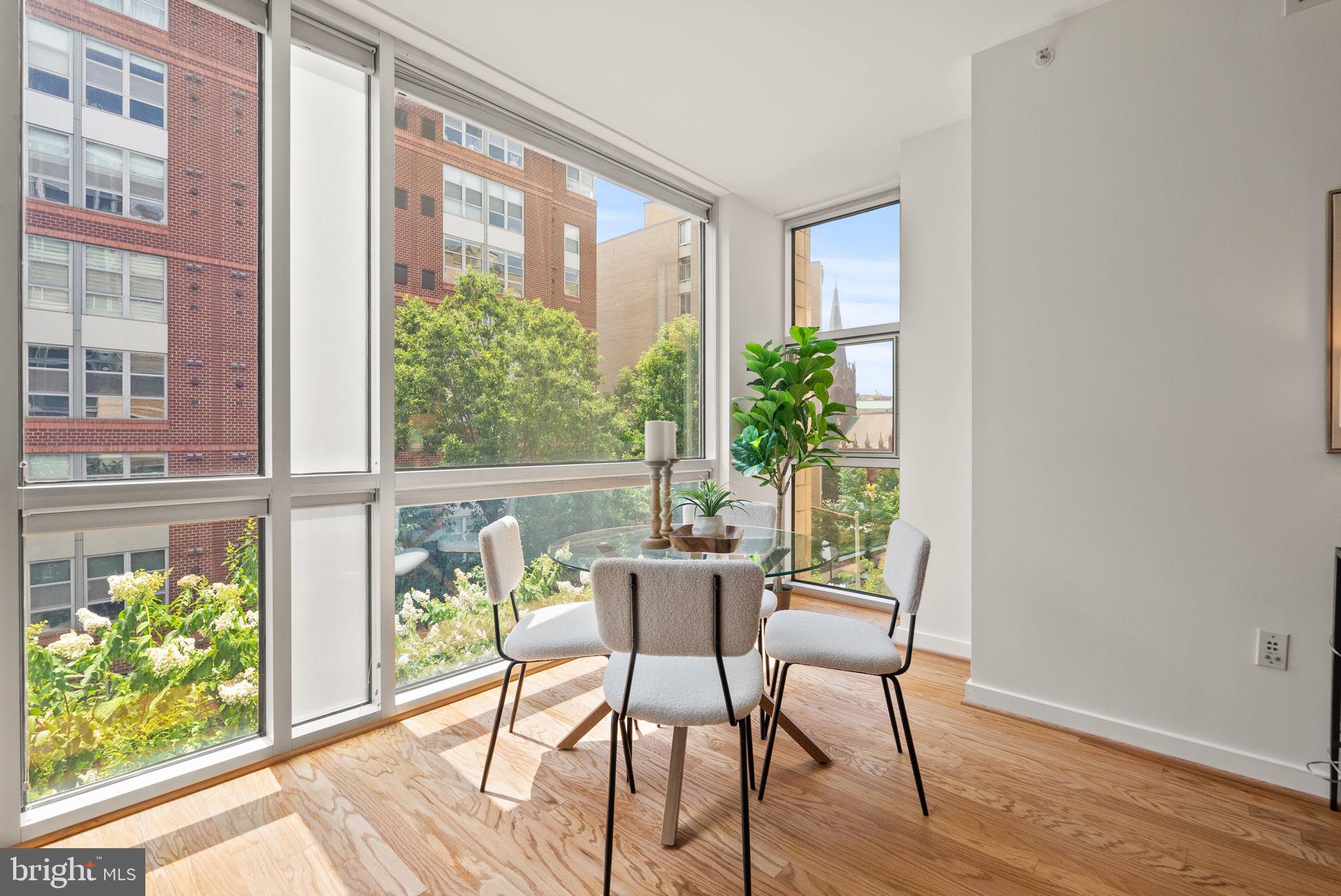 1300 13th Street Northwest, Unit 408 Washington, DC 20005 - Photo 21 of 47 a dining room with wooden floor and windows