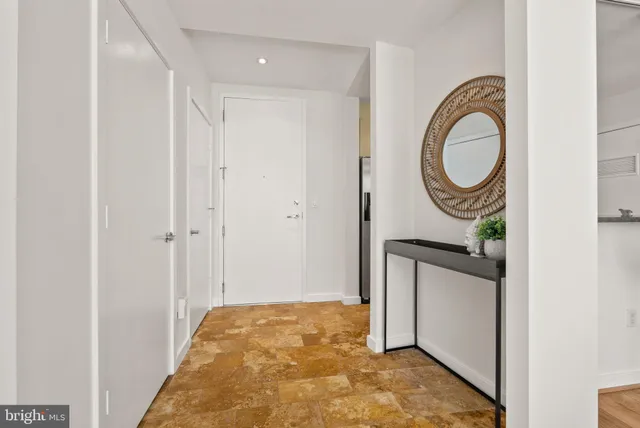 a view of a bathroom with sink and mirror