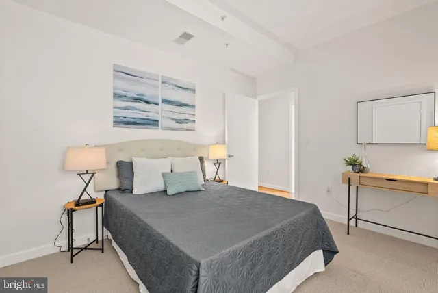 a bedroom with a bed and furniture