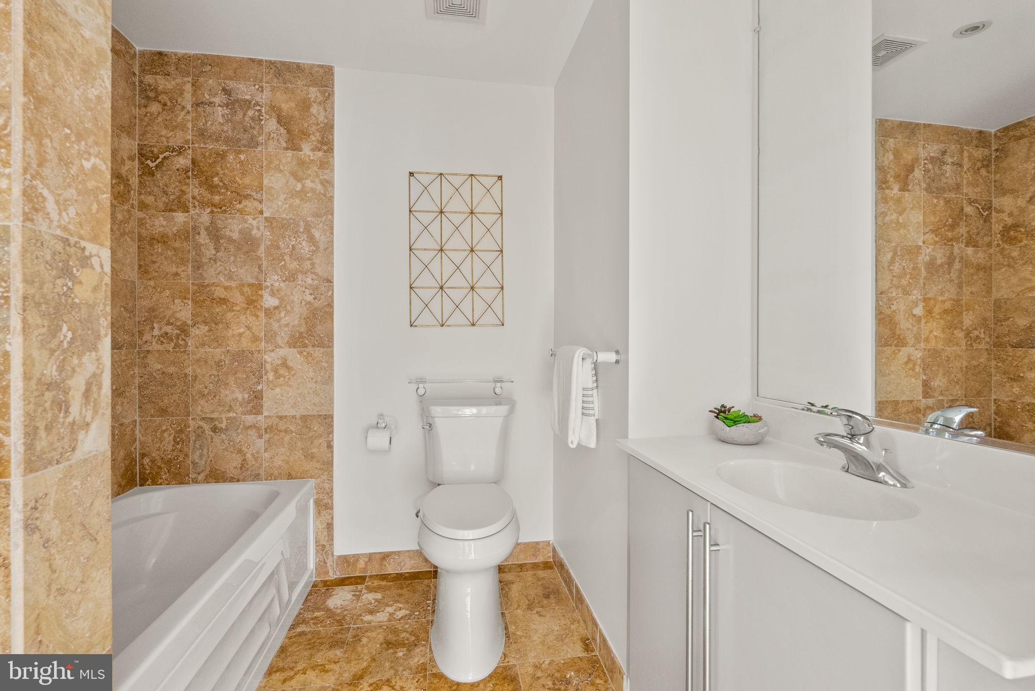 1300 13th Street Northwest, Unit 408 Washington, DC 20005 - Photo 29 of 47 a bathroom with a sink toilet and shower