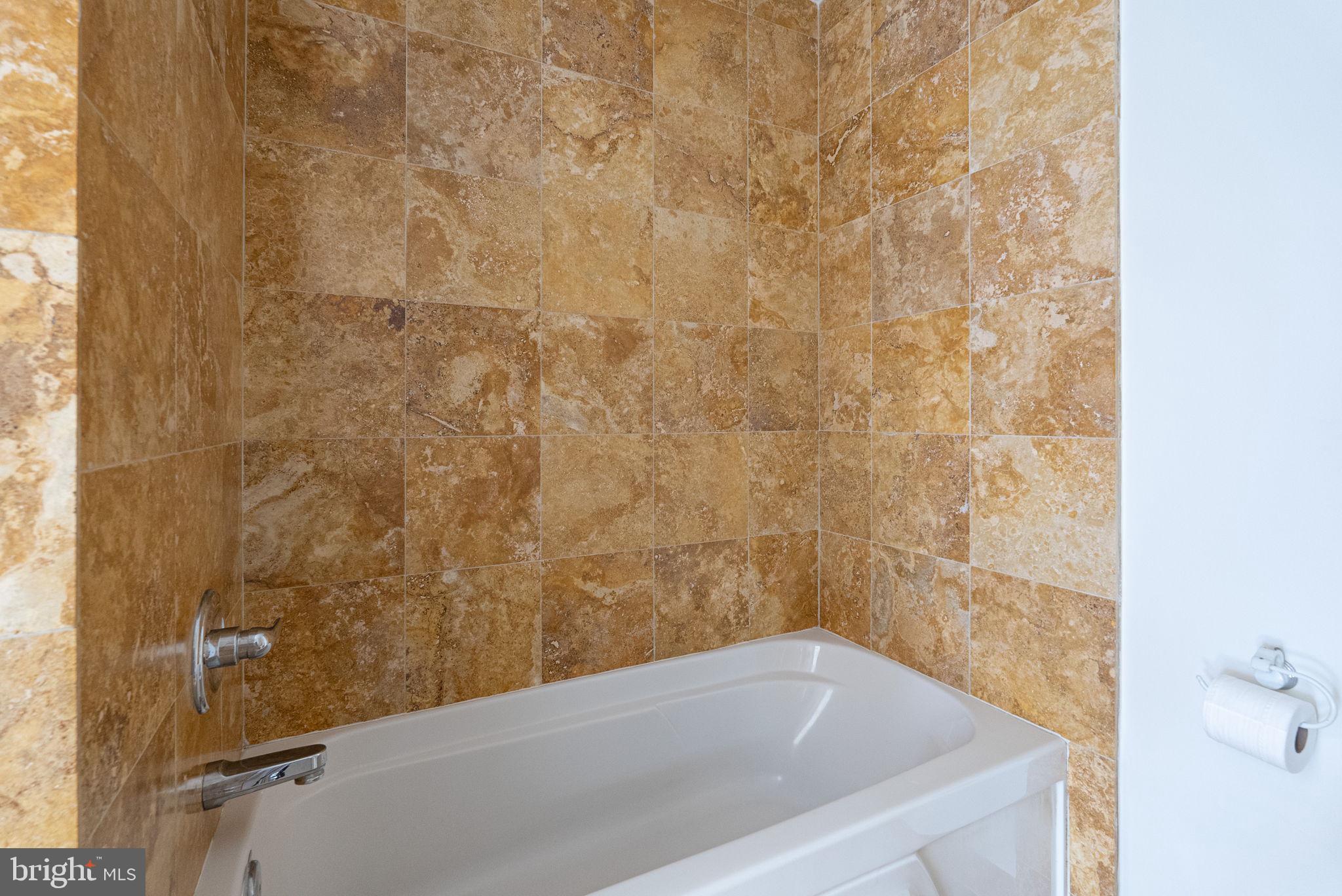 1300 13th Street Northwest, Unit 408 Washington, DC 20005 - Photo 30 of 47 a bathroom with a bathtub